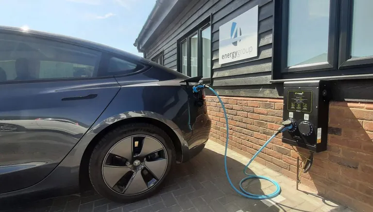 A Tesla car charging outside the 4energy group offices in Wickford. Essex. 4energy group are transitioning our vehicle fleet to fully electric, as part of our commitment to ESG.