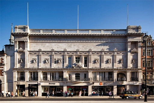 An exterior view of the ornate architecture of BAFTA's iconic headquarters, a historic Grade II listed building, situated on a busy street in Piccadilly, London