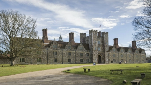 An exterior view of Knole, a historic home in Kent, is shown set amidst its expansive grounds. It has a state-of-the-art BEMS installation by 4energy group to maintain the temperature and humidity within the house and protect the valuable artifacts inside