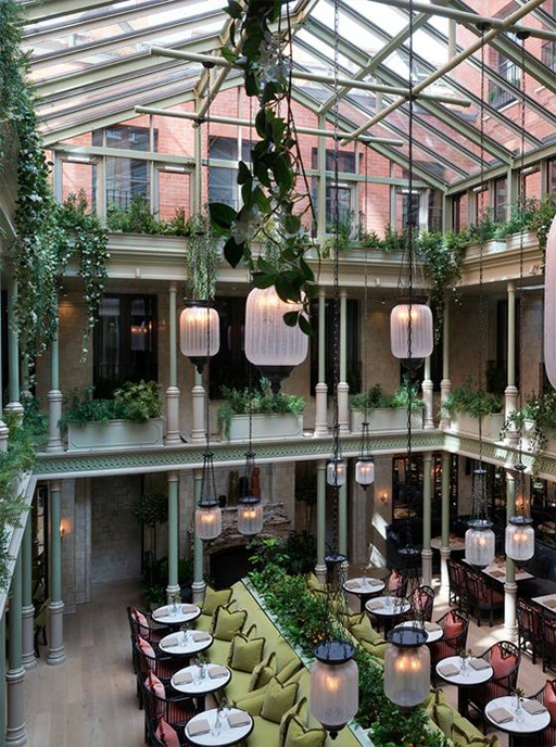 Triple height glass conservatory restaurant at NoMad Hotel, Covent Garden, London, formerly the Bow Street Magistrates’ Court. 4energy group were part of the group that created the hotel and we continue to provide servicing and maintenance for the hotel's BEMS.